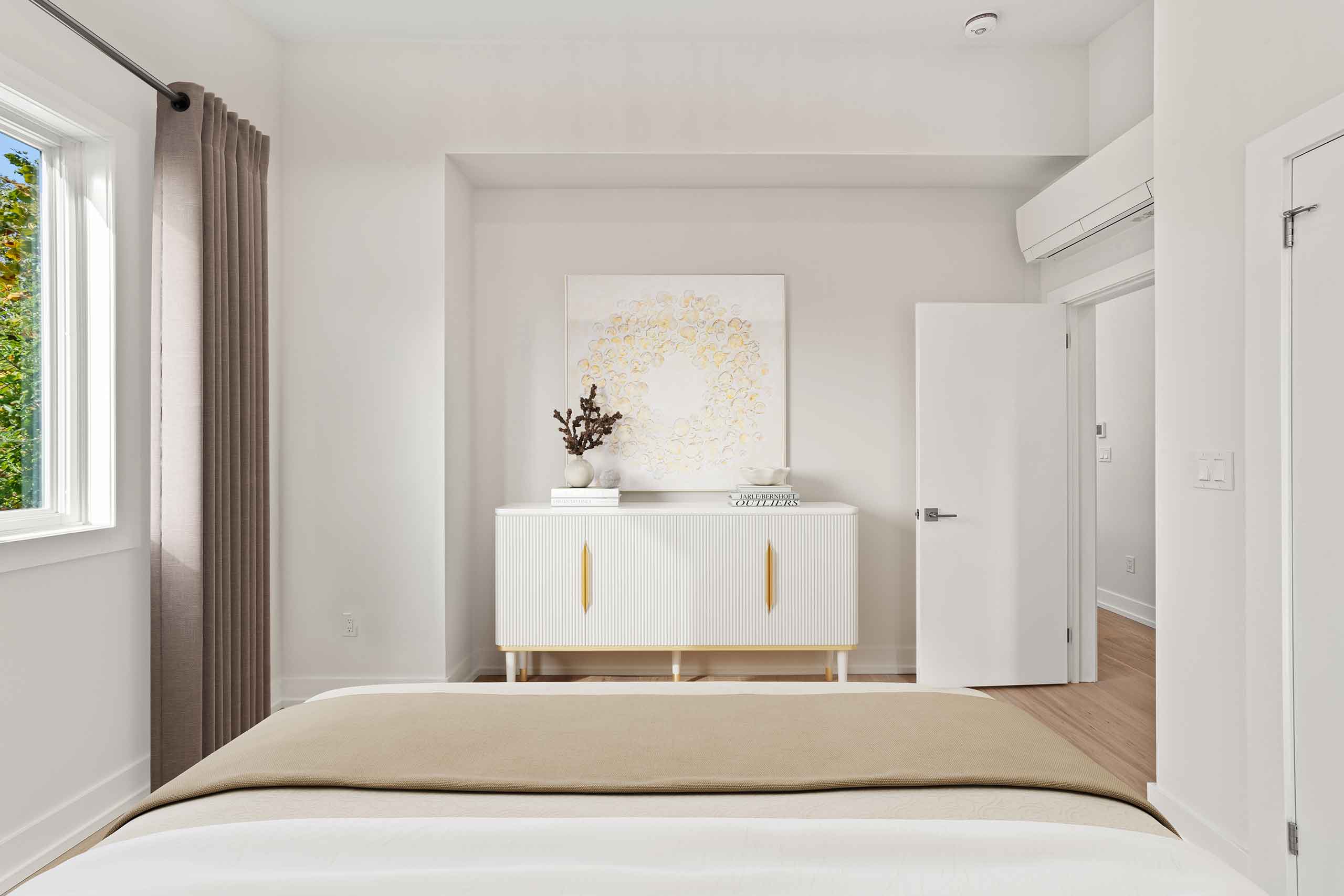 Contemporary bedroom decor with neutral colors in a garden suite